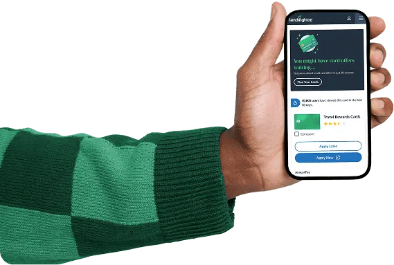 Hand holding a phone showing LendingTree card matches